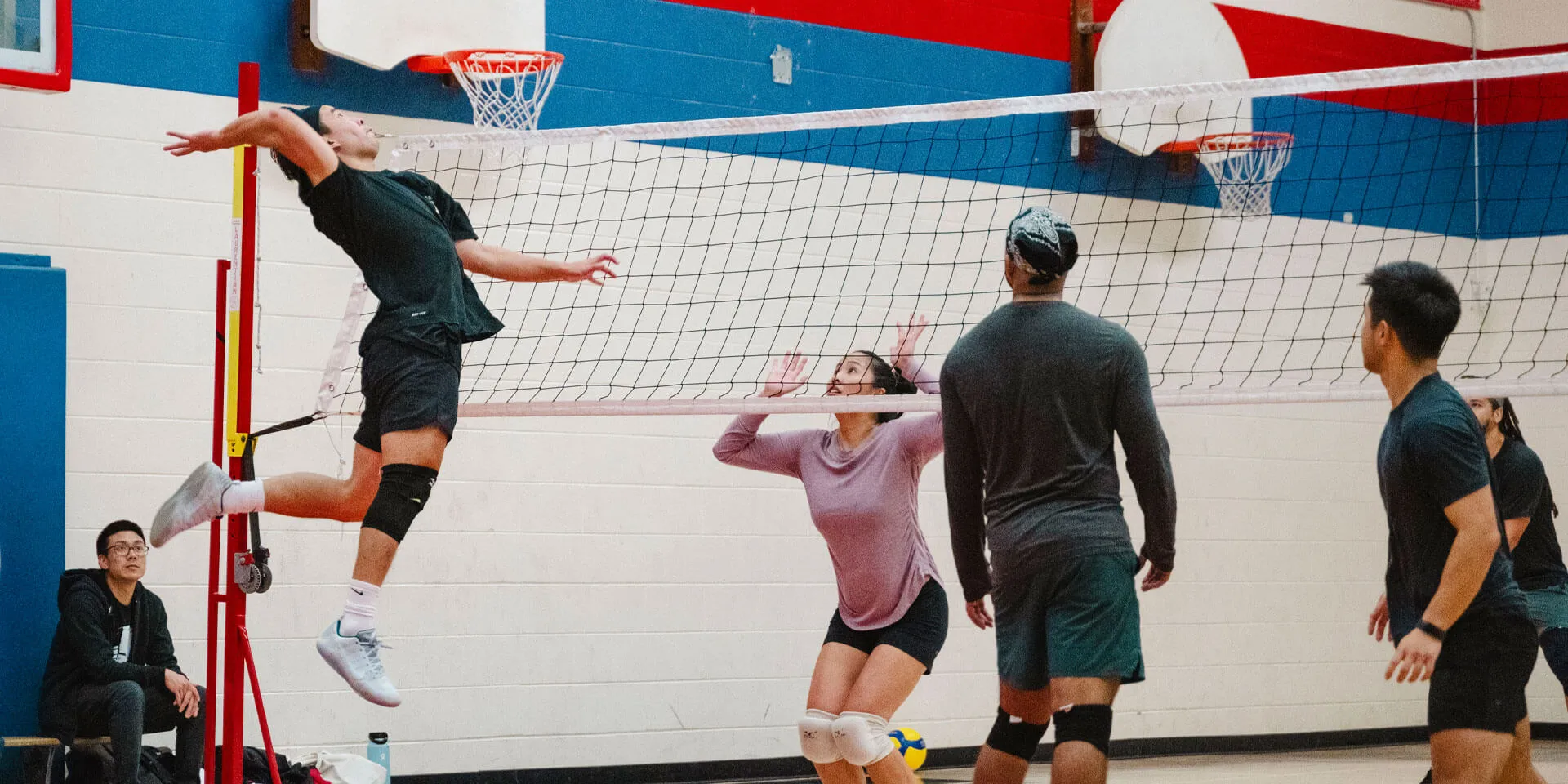 Coed indoor volleyball teams playing in a Mississauga recreational league